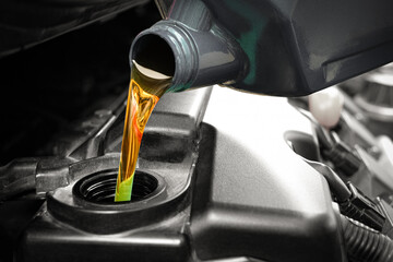 Refueling and pouring oil quality into the engine motor car Transmission and Maintenance Gear .Energy fuel concept.