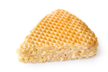 A piece of waffle cake on a white background. Sweet waffle cake close-up.