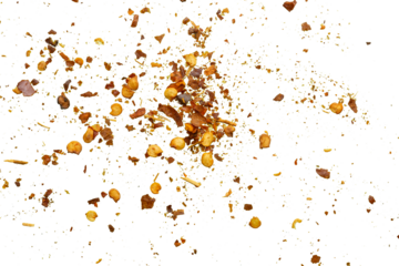 dried red chili pepper flakes and seeds isolated on white background