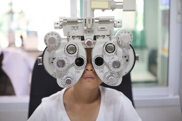 doctor examining patient, kid eye exam 