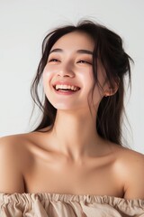Close-up of a Pretty Young Chinese Woman in Off-the-Shoulder Crop Top and Wide-Leg Jumpsuit, emanating summery vibes with a bright smile photo on white isolated background