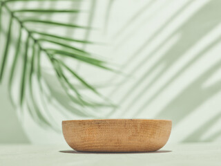 Wooden Bowl with Palm Leaf Shadow on Table