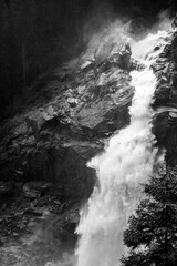 Krimml Waterfalls on sunny summer day. High Tauern National Park, Austrian Alps, Austria. Black and white image. - 774638354