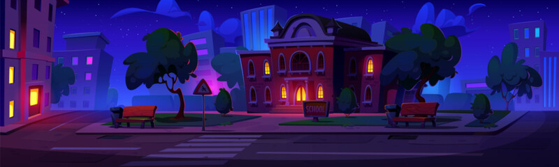 Fototapeta premium School building outside at night. Cartoon vector city landscape with dark education house with light in windows and streetlights, yard with trees and bench on pavement, road with crosswalk and sign.