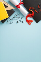 Capture the essence of achievement with a top view vertical composition showcasing mortarboard,...