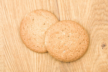 Oatmeal cookies on a wooden background, top view, flat lay