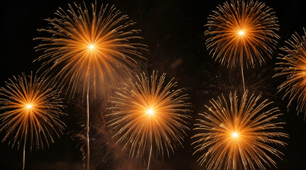 Naklejka premium Bursts of golden and orange fireworks against a black sky. generative.ai