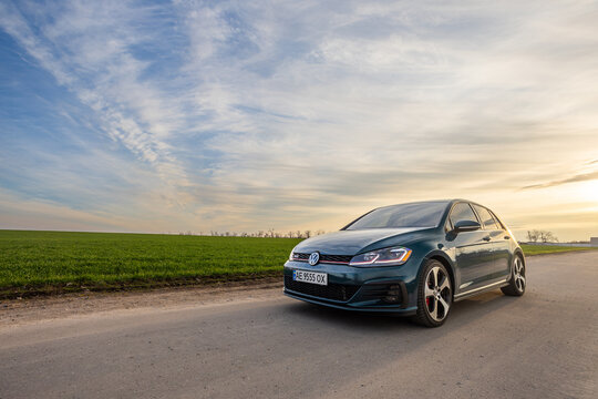 Krivoy Rog, Ukraine &ndash; March 24, 2024: Photo of green car Volkswagen Golf GTI on the street.