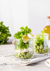 green salad in a jar with edamame beans