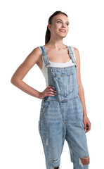 Obraz premium A young woman wearing denim overalls smiling and looking up, with a white background, studio photo