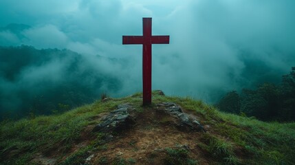   A hilltop cross amidst foggy day's mist, sky backdrop shrouded in mystery