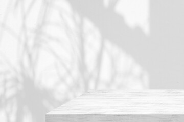 White wood table with shadow and light in the glass house on concrete wall background, suitable for product presentation backdrop, display, and mock up.