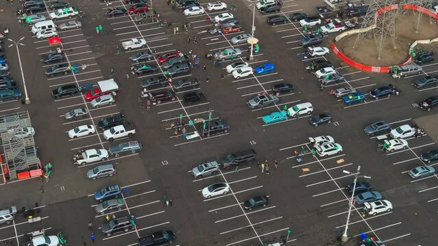 Fans boycott the Oakland A's and tailgate in the parking lot - aerial orbit