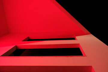 Obraz premium Architectural structure illuminated with red lights at night