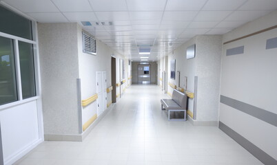 Empty modern hospital corridor with sitting couch. Outpatient medical care concept