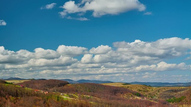 Nature landscape cumulus clouds rolling over hills and mountains time-lapse