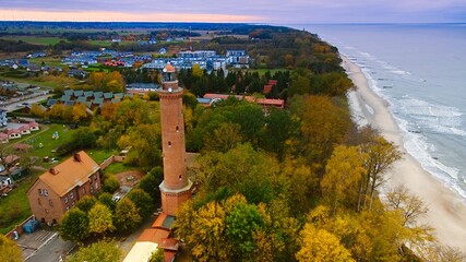 Captured by drone on a cloudy November day, the Gąski lighthouse stands against the somber sky.