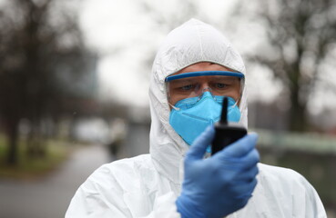 Male virologist hold infection source detector portrait. Chinese corona virus concept