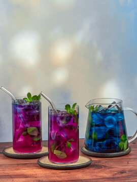 Iced blue tea is made from Anchan flowers, also known as butterfly peas (Clitoria ternatea). It turns purple when lemon is added.