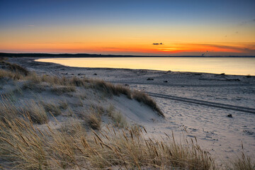 A beautiful sunset on the beach of the Sobieszewo Island at the Baltic Sea at spring. Poland