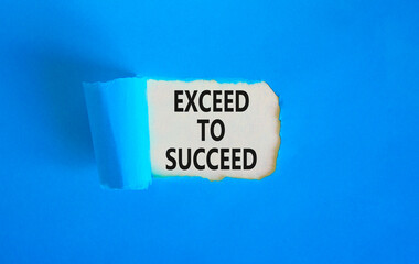 Exceed to succeed symbol. Concept words Exceed to succeed on beautiful white paper. Beautiful blue paper background. Business and exceed to succeed concept. Copy space.