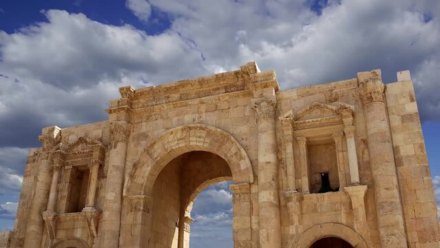 Roman ruins (against the background of a beautiful sky with clouds, 4K, time lapse, with zoom) in the Jordanian city of Jerash (Gerasa of Antiquity), Jordan  