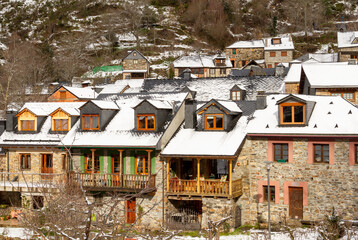 Snow-covered houses in a picturesque mountain village
