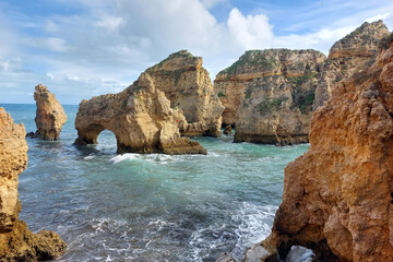 Rocky Sea Arches at Algarve Coast. World Oceans Day