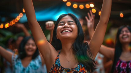Cheerful young latin girl dancing at a summer music festival at night. - obrazy, fototapety, plakaty