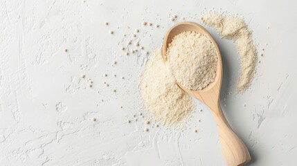 On a white background, there is a scoop of dry yeast