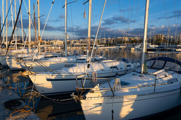 Various sailboats in a marina of Thessaloniki, Greece at sunset - 774754348