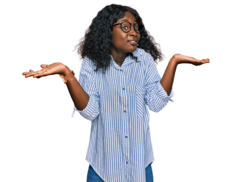 Beautiful african young woman wearing casual clothes and glasses clueless and confused expression with arms and hands raised. doubt concept.