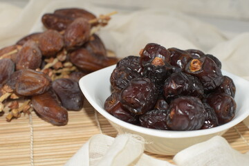 Two type of date fruit, Lulu and Tunisian dates. Lulu type is much smaller and dark compared to the...