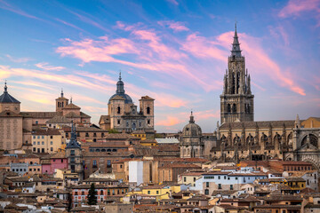 Detailed view from a distance of the monumental historic center and declared a World Heritage Site by UNESCO of the city of Toledo, Spain, at dusk - obrazy, fototapety, plakaty