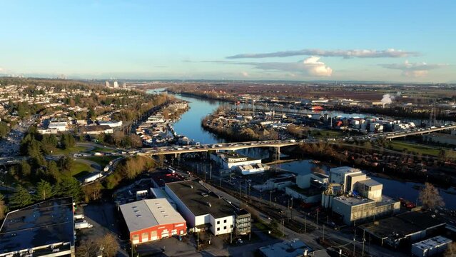 Traffic At Knight Street Bridge From South Vancouver Crossing Over Mitchell Island And Fraser River To Richmond In BC, Canada. - aerial shot