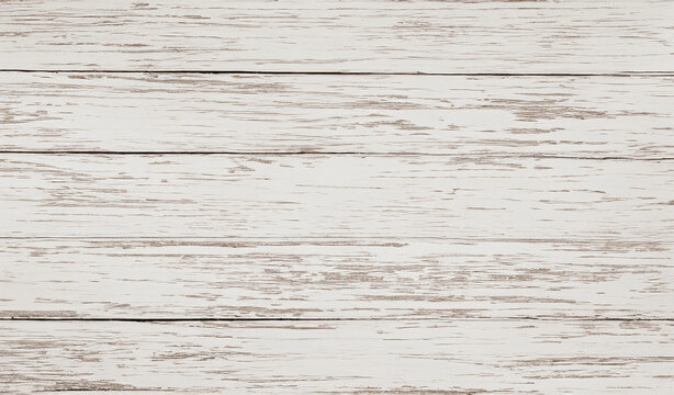 Weathered white wooden planks offer a distressed aesthetic perfect for vintage-inspired projects