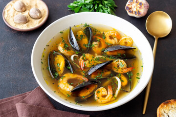 Soup with mussels, shrimps and squid. Healthy eating. Seafood.