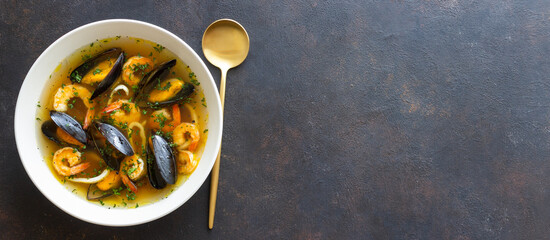Soup with mussels, shrimps and squid. Healthy eating. Seafood.