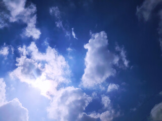 Bright blue sky clouds background in the daylight