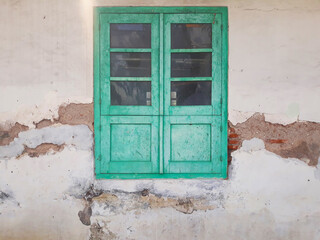 Ruined old wall with vintage traditional window