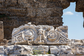 Crumbled marble frieze and column remnants in Side. Side, Antalya, Turkey (Turkiye)