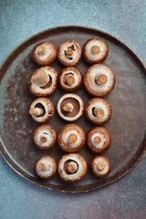 Foto op Plexiglas Fresh champignons close-up. Top view. Rustic style. © Yaruniv-Studio