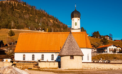 Church on a sunny winter day at Wallgau, Garmisch-Partenkirchen, Werdenfelser Land, Bavaria, Germany