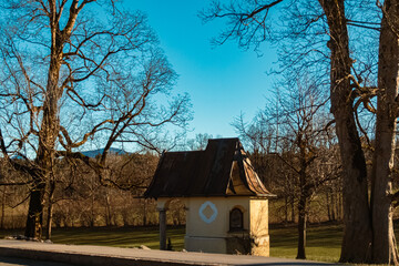 Chapel on a sunny winter evening near Schweinthal, Miesbach, Bavaria, Germany