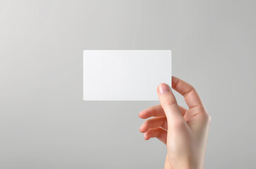 Business card mockup in woman hand. Blank calling card template on isolated background. Generative ai - 774788312