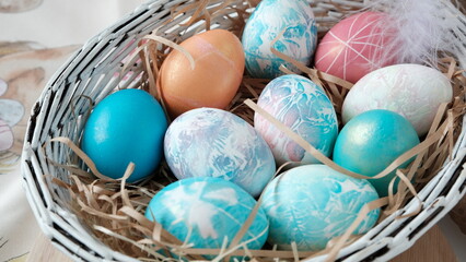 Easter eggs in a basket. Easter composition. Holiday concept.