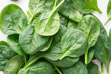Highlight the freshness and vibrancy of spinach leaves in a visually appealing composition - obrazy, fototapety, plakaty