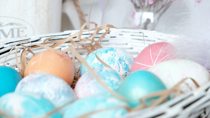 Easter eggs in a basket. Easter composition. Holiday concept.