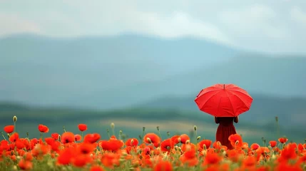 Foto op Plexiglas A poppy field with a red umbrella in the distance. © Abdul