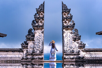 Asian woman standing in Bali gate, Pura Luhur Lempuyang temple Bali, Indonesia. - 774797529